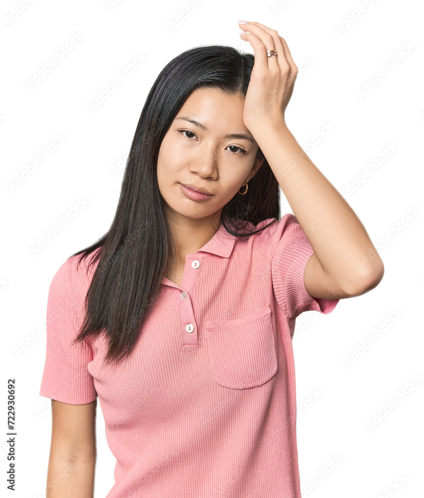 Young Chinese woman in studio setting tired and very sleepy keeping hand on head. Young Chinese woman in studio setting tired and very sleepy keeping hand on head.