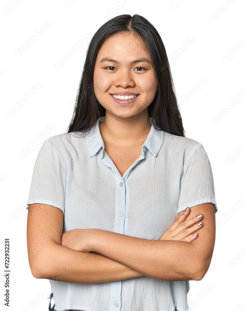 Young chinese woman isolated who feels confident, crossing arms with determination. Young chinese woman isolated who feels confident, crossing arms with determination.