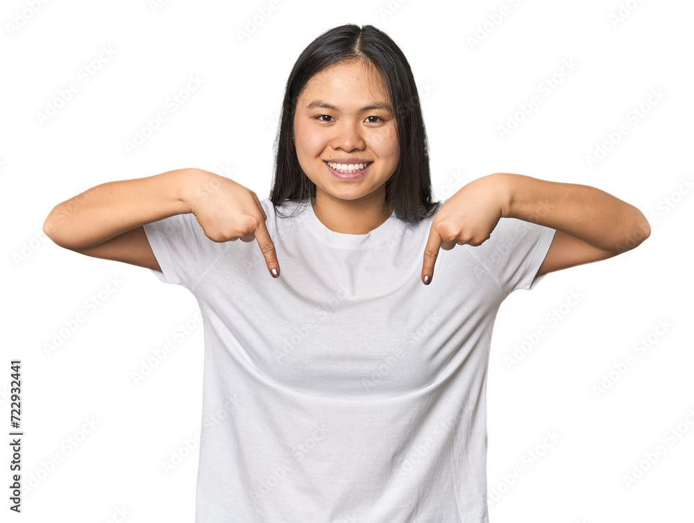 Young chinese woman isolated points down with fingers, positive feeling. Young chinese woman isolated points down with fingers, positive feeling.