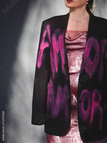 girl wearing the jacket with pink words 
