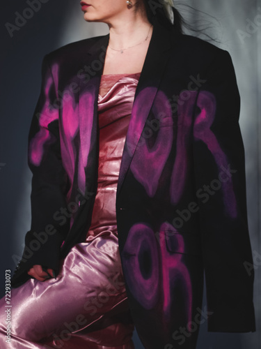 girl wearing the jacket with pink words 