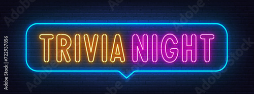 Trivia Night neon sign in the speech bubble on brick wall background.
