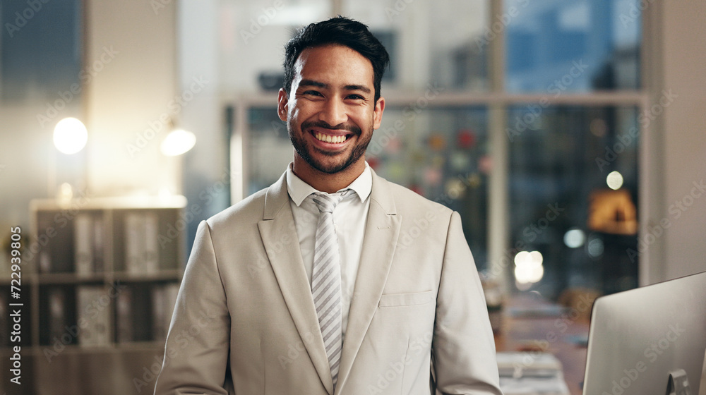 Fototapeta premium Night, corporate and face of happy man, agent or HR employee smile for startup company management. Happiness, expert and portrait person confident, smile and work in Vietnam human resources office
