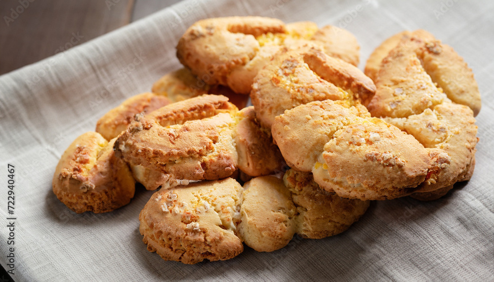 Traditional homemade italian torchetta cookies on a linen napkin, selective focus. Concept of traditional Italian desserts. Traditional homemade italian torchetta cookies on a linen napkin, selective focus. Concept of traditional Italian desserts.