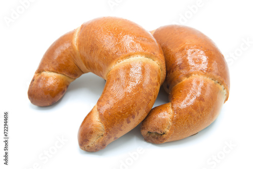 Freshly baked croissant isolated on white background.
