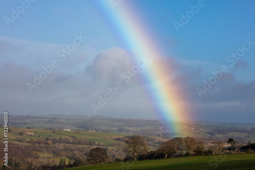 Rainbow over farmland and fields in County Durham, England, UK.