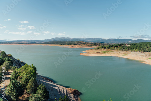 Green water lake on a summer sunny day in Aguilar de Campoo, Spain photo