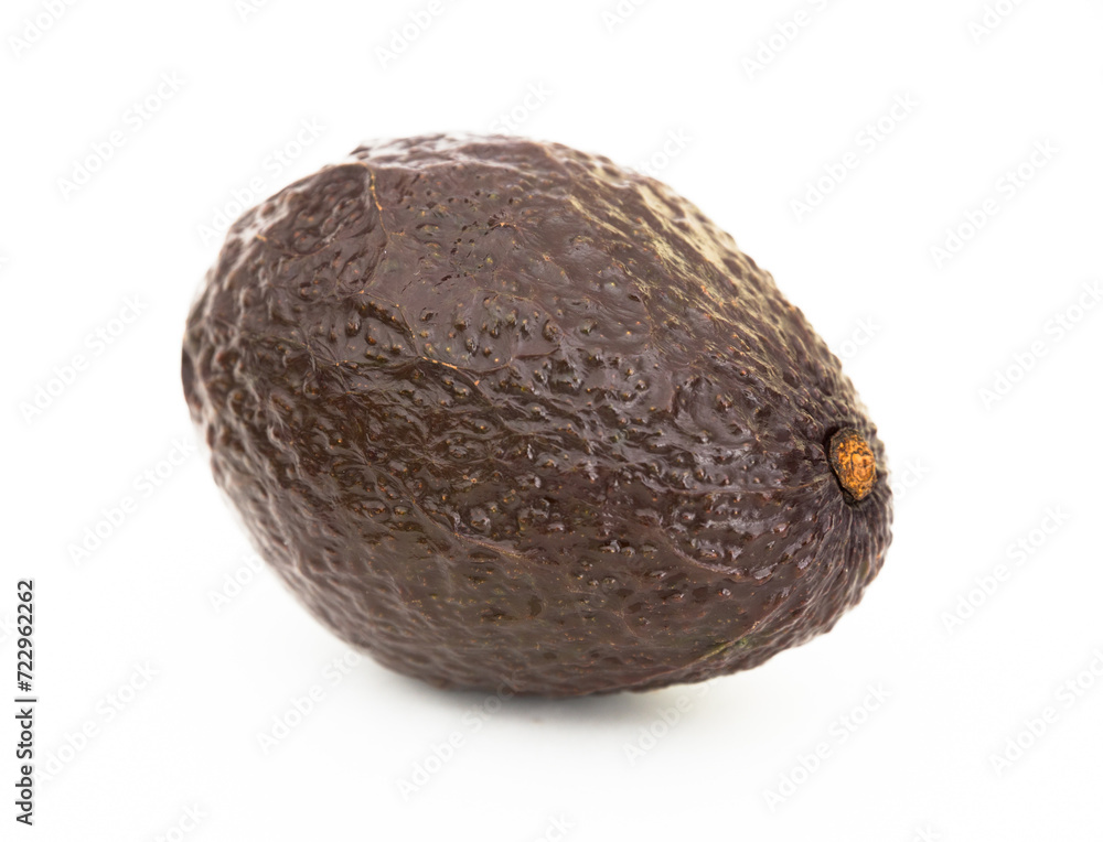 Ripe dark avocado on white background Ripe dark avocado on white background