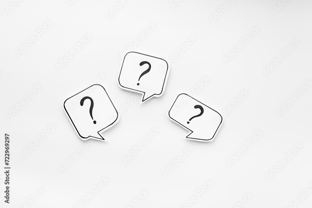 Question marks on paper speech bubbles. FAQ concept or search information concept Question marks on paper speech bubbles. FAQ concept or search information concept