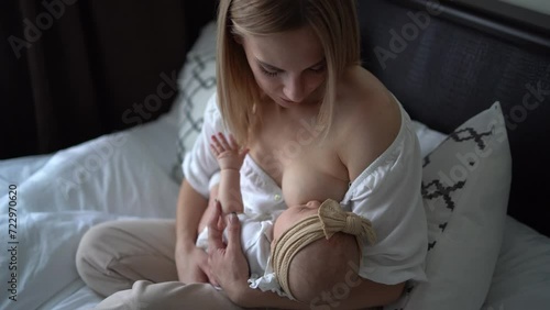 Caucasian mother brestfeed her child photo