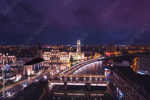 Ethereal Skyscape: Mesmerizing Aerial View of Oradea, Romanias Vibrant Cityscape Illuminated at Night