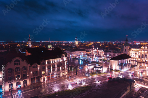 Midnight Symphony: A Captivating Aerial Glimpse of Oradea, Romanias Vibrant Cityscape Bathed in Moonlit Splendor