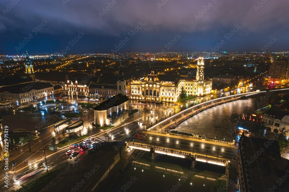 Luminescent Tapestry of Oradea: A Captivating Aerial View of a Bustling Romanian City at Night.