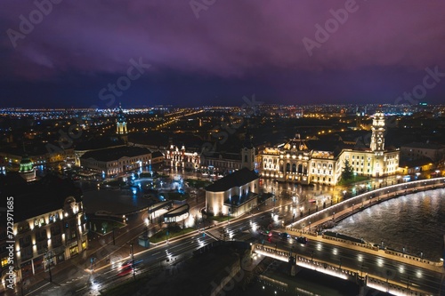 Luminous Urban Tapestry: A Bewitching Aerial View of Oradeas Nocturnal Splendor