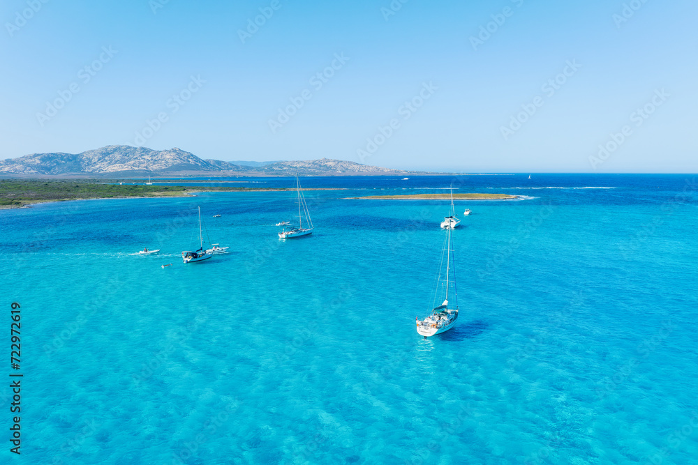 Obraz premium Drone view of a sailing yacht. Vacationing people. Vacation and holidays. Summer time for sea travel. The sea bay. Photo for background and wallpaper. Mediterranean Sea.