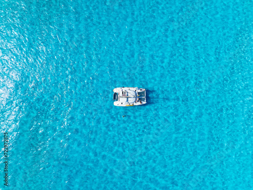 Drone view of a sailing yacht. Luxury transportation. Vacation and holidays. Summer time for sea travel. The sea bay. Photo for background and wallpaper. © biletskiyevgeniy.com