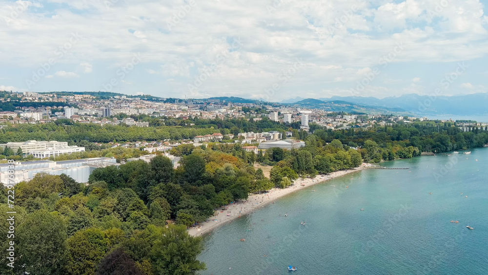 Lausanne, Switzerland - July 16, 2023: The new building of the International Olympic Committee is located on the shores of Lake Geneva. Summer day, Aerial View