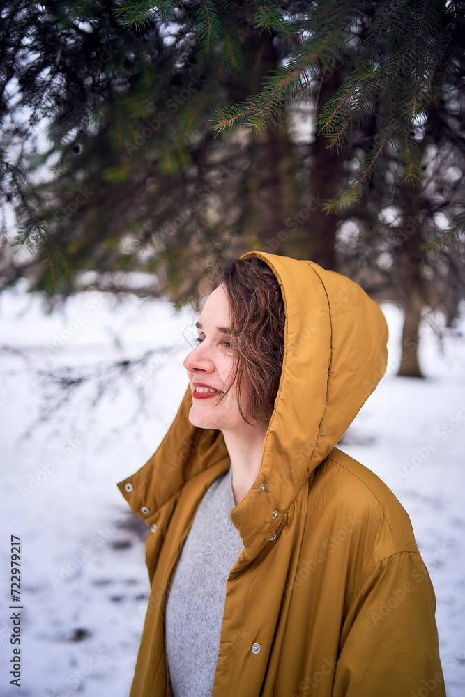 woman in yellow coat in the forest woman in yellow coat in the forest