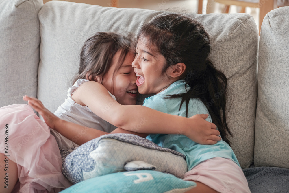 Young multicultural girls having a hug Young multicultural girls having a hug