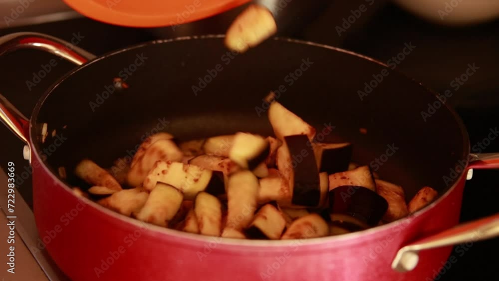 sizzling delight: frying eggplant in a pan close-up sizzling delight: frying eggplant in a pan close-up