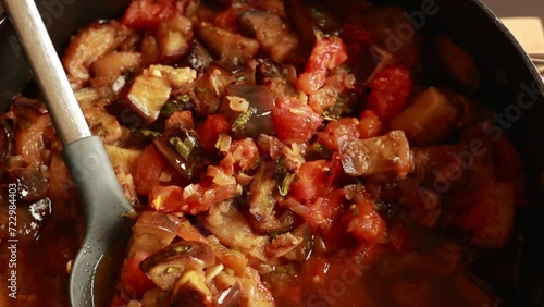 homestyle goodness: eggplant stew in pan close-up photo