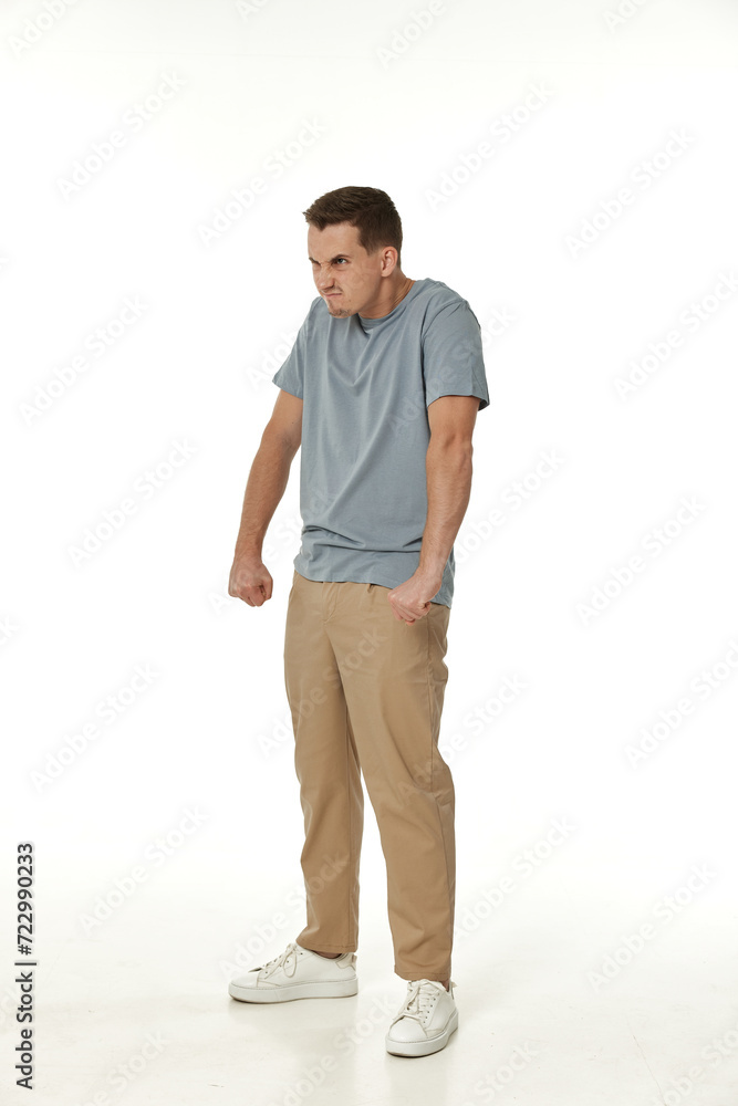 annoyed angry man standing on white studio background annoyed angry man standing on white studio background