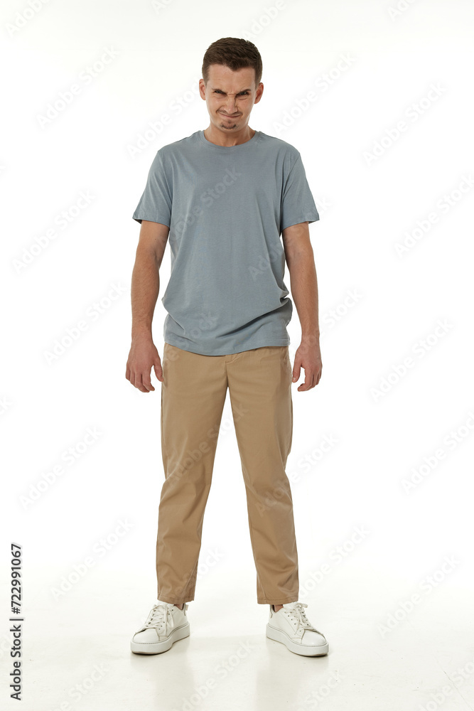 annoyed angry man standing on white studio background annoyed angry man standing on white studio background
