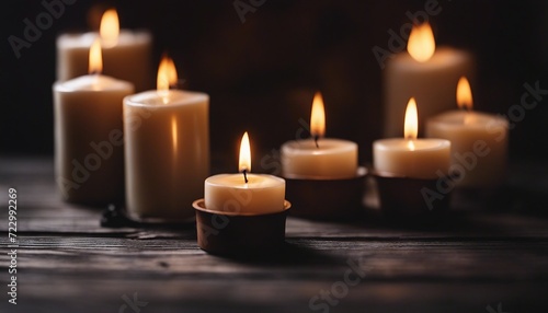 Burning candles on dark wooden background  peaceful scene  copy space for text 