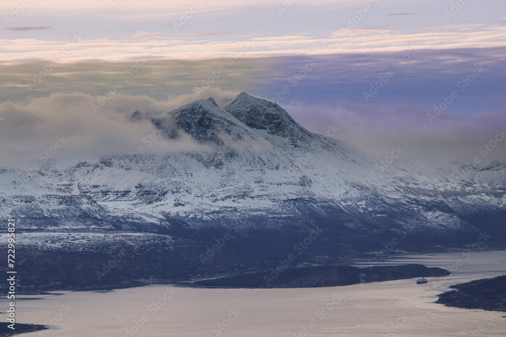 Naklejka premium mountain panorama with clouds and snow