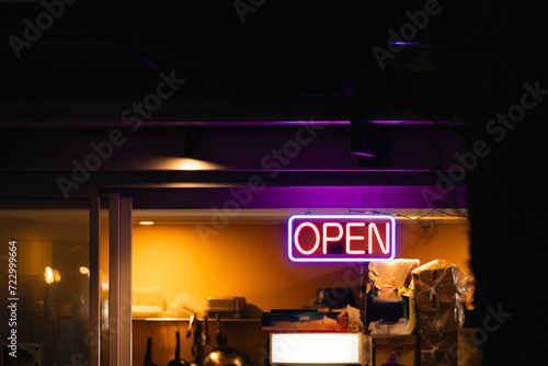 Neon open sign illuminated at take away noodle bar photo