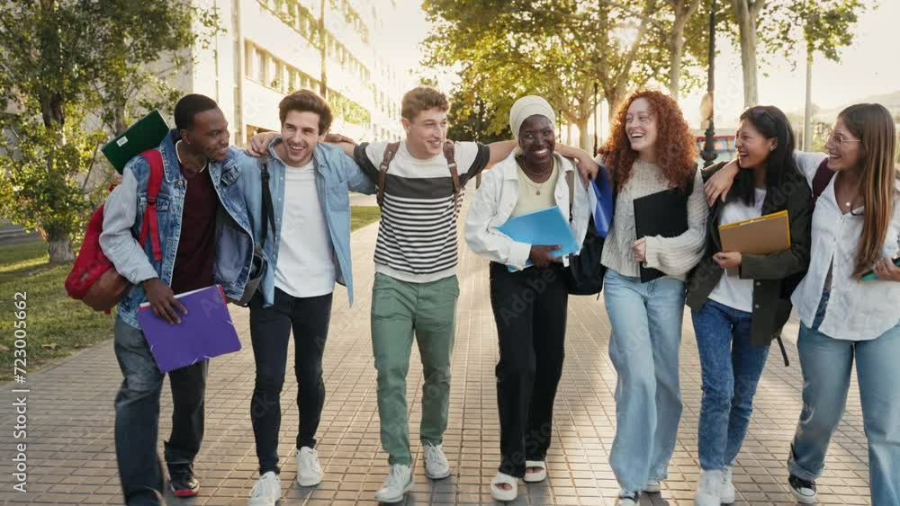 Group of multiracial gen z student friends embracing each other and walking together in the city. Youth diversity