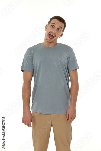 surprised guy looking at camera on white studio background