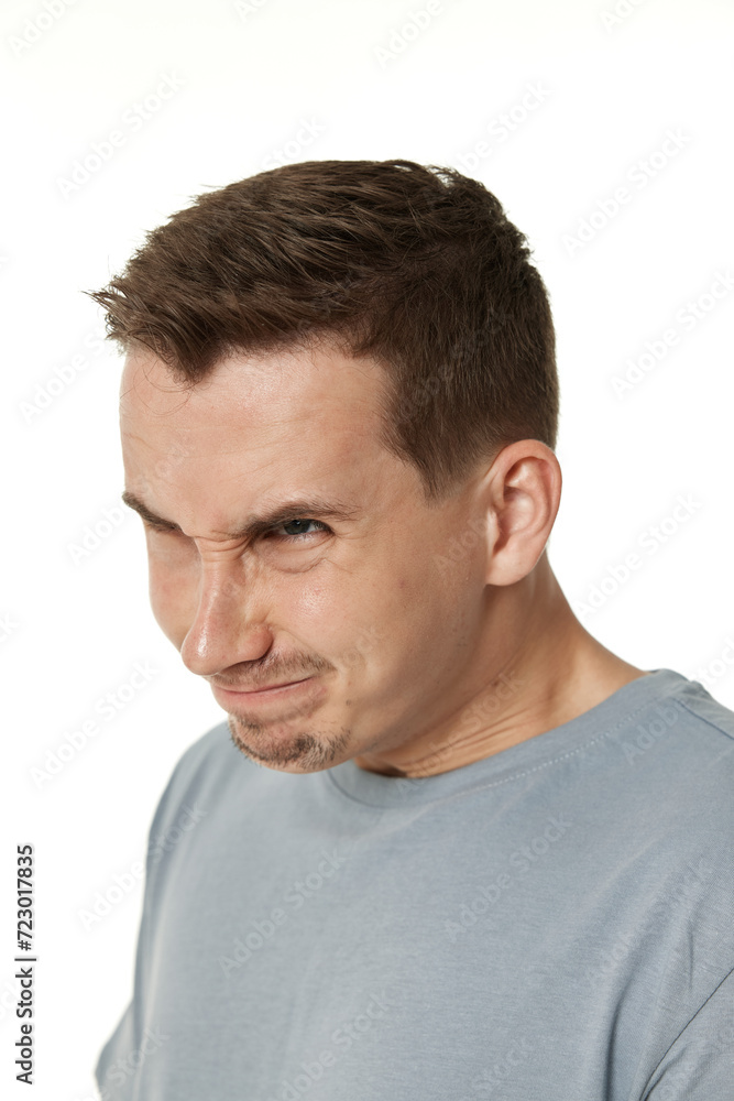 offended frustrated young man on white background. sadness offended frustrated young man on white background. sadness