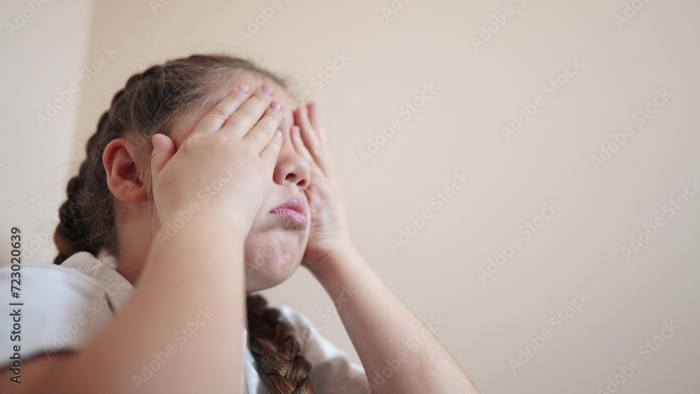 sad girl sitting in the corner crying a covered her face with her hands. family violence abuse child concept. indoor parents punished the child put in a corner. child in depression crying lifestyle sad girl sitting in the corner crying a covered her face with her hands. family violence abuse child concept. indoor parents punished the child put in a corner. child in depression crying lifestyle