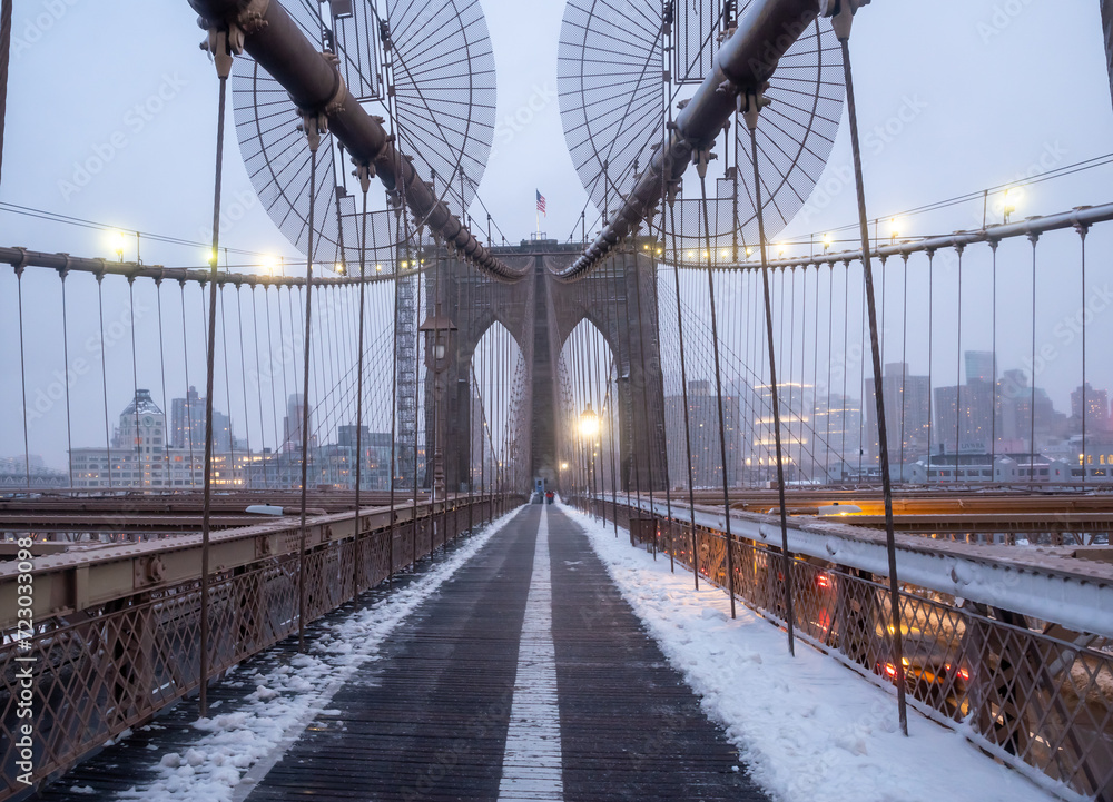 Fototapeta premium Brooklyn Bridge is covered under a blanket of snow. New York, USA