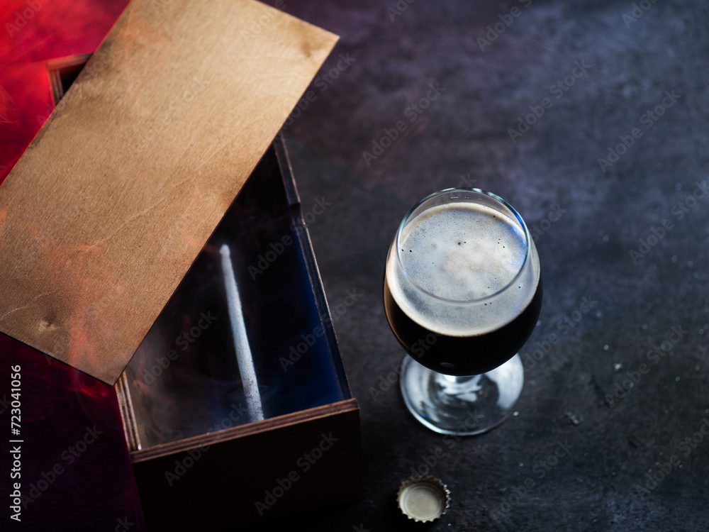 A gift beer bottle in a wooden box. A Father's Day gift. Craft Dark Beer Bottle A gift beer bottle in a wooden box. A Father's Day gift. Craft Dark Beer Bottle