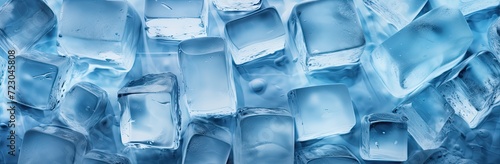 An image of ice cubes on a background tinted in bluish hues, depicting the concept of frozen water. photo