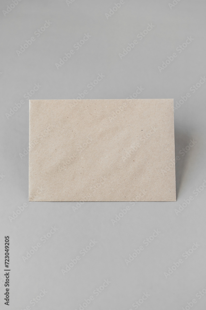 beige envelope on a light background. free space for text. beige rectangle beige envelope on a light background. free space for text. beige rectangle
