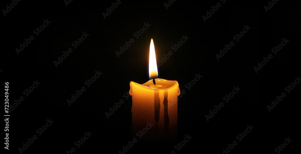 Lighted candle isolated on black Lighted candle isolated on black
