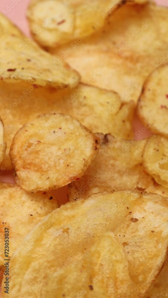 potato chips, rotation in circle. golden chips (fast food), Turning. selective focus. Vertical video potato chips, rotation in circle. golden chips (fast food), Turning. selective focus. Vertical video