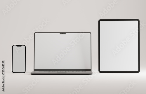 High end phone, tablet and laptop on white studio backdrop. Blank mockup template screen.
