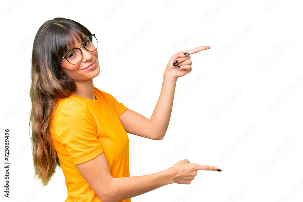 Young caucasian woman over isolated chroma key background pointing finger to the side and presenting a product Young caucasian woman over isolated chroma key background pointing finger to the side and presenting a product