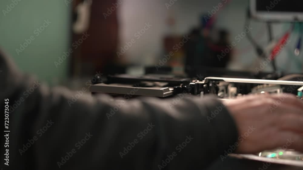 electronics repair. repair of consumer electronics. insert a CD into the player. High quality video in 4k electronics repair. repair of consumer electronics. insert a CD into the player. High quality video in 4k