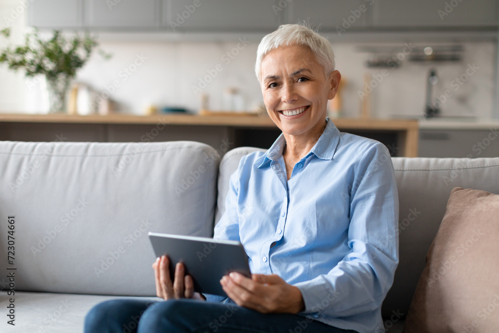 Mature Woman With Stylish Haircut Posing With Digital Tablet Indoor Mature Woman With Stylish Haircut Posing With Digital Tablet Indoor