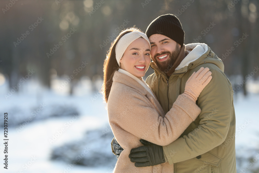 Beautiful young couple enjoying winter day outdoors Beautiful young couple enjoying winter day outdoors