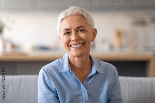 Portrait of beautiful senior woman with short gray hair indoor