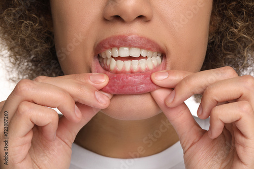 Woman showing her clean teeth  closeup view