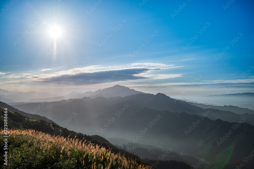 Clouds and mist rolled over the valley. Blue sky, white clouds, sunshine. Warm winter mountain scenery in northern Taiwan, Shuangxi Buyanting Pavilion. Clouds and mist rolled over the valley. Blue sky, white clouds, sunshine. Warm winter mountain scenery in northern Taiwan, Shuangxi Buyanting Pavilion.