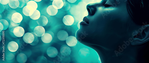 A woman's profile basks in the ethereal glow of bokeh lights, invoking a serene dreamscape