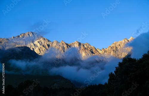 Peaks of Massive Mountain Ridge at Dusk. Caucasus Mountains